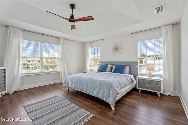 28 S Comares Ave, Saint Augustine Beach, FL 32080 - bedroom with multiple windows, baseboards, and wood finished floors