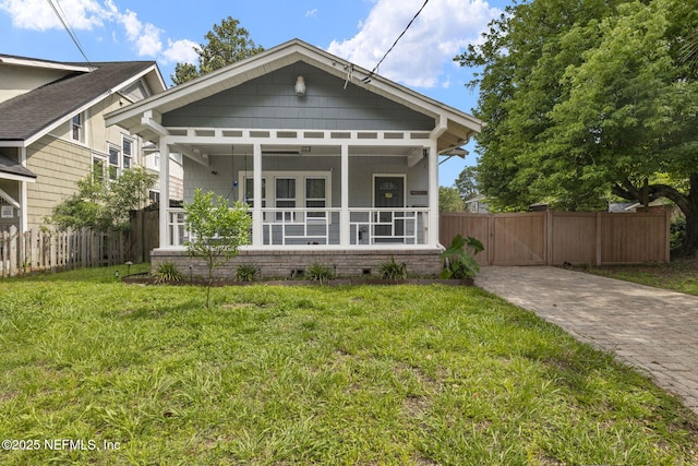 4524 Post St, Jacksonville, FL 32205 - shotgun-style home featuring a gate and covered porch