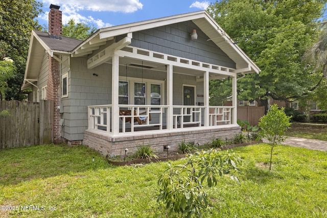4524 Post St, Jacksonville, FL 32205 - view of home's exterior with a chimney and covered porch