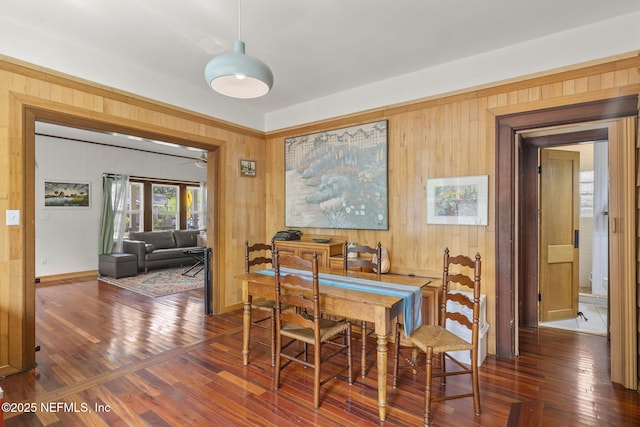 4524 Post St, Jacksonville, FL 32205 - dining area featuring wood walls, wood finished floors, and baseboards