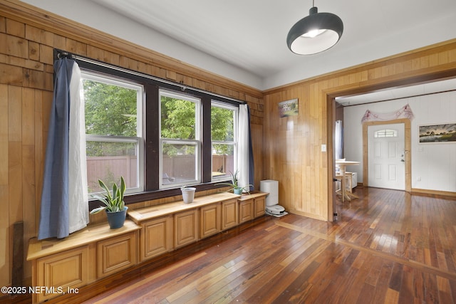 4524 Post St, Jacksonville, FL 32205 - dining room with healthy amount of natural light, wood walls, hardwood / wood-style flooring, and baseboards