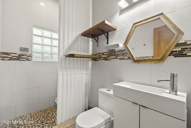 4524 Post St, Jacksonville, FL 32205 - full bath with tile walls, toilet, vanity, and a tile shower