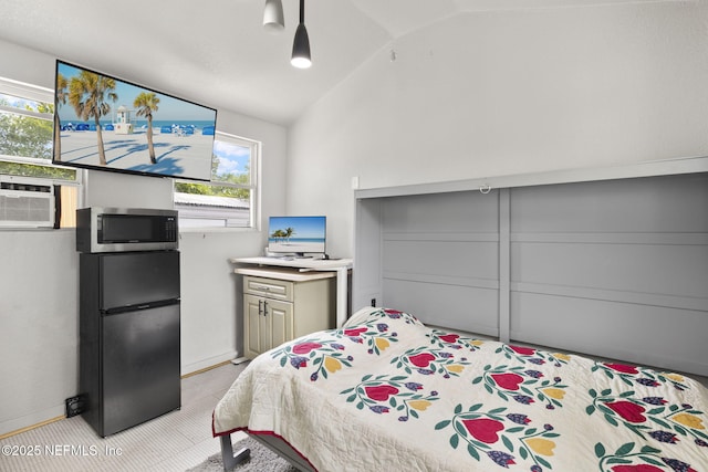 4524 Post St, Jacksonville, FL 32205 - bedroom with freestanding refrigerator, vaulted ceiling, and baseboards