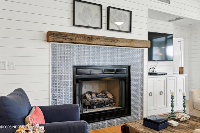 310 S Ocean Grande Dr Unit 205, Ponte Vedra Beach, FL 32082 - detailed view of a tiled fireplace, wood finished floors, and wood walls