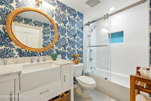 310 S Ocean Grande Dr Unit 205, Ponte Vedra Beach, FL 32082 - bathroom with wallpapered walls, vanity, and enclosed tub / shower combo
