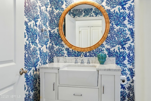 310 S Ocean Grande Dr Unit 205, Ponte Vedra Beach, FL 32082 - bathroom with wallpapered walls and vanity