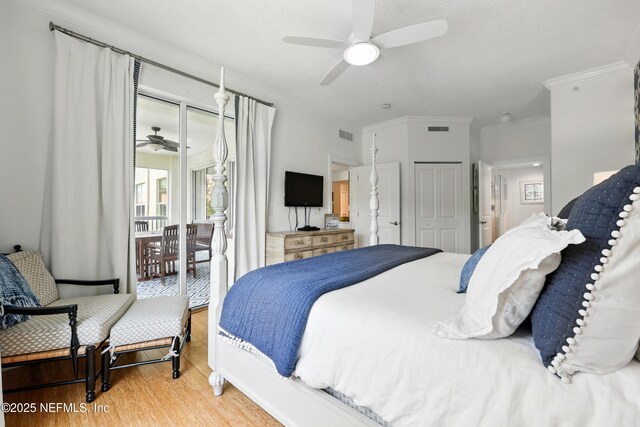 310 S Ocean Grande Dr Unit 205, Ponte Vedra Beach, FL 32082 - bedroom with wood finished floors, access to outside, a closet, crown molding, and a ceiling fan