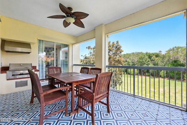 310 S Ocean Grande Dr Unit 205, Ponte Vedra Beach, FL 32082 - sunroom / solarium with exterior kitchen, a ceiling fan, and outdoor dining area