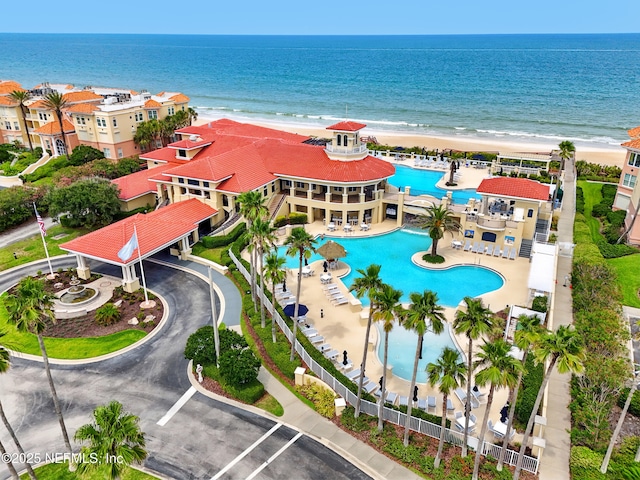 310 S Ocean Grande Dr Unit 205, Ponte Vedra Beach, FL 32082 - bird's eye view of waterfront with a beach and a pool