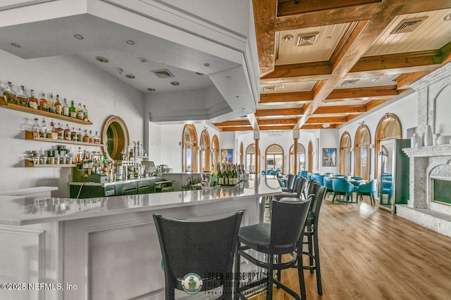 310 S Ocean Grande Dr Unit 205, Ponte Vedra Beach, FL 32082 - indoor dry bar with coffered ceiling, wood finished floors, and a wood ceiling with exposed beams