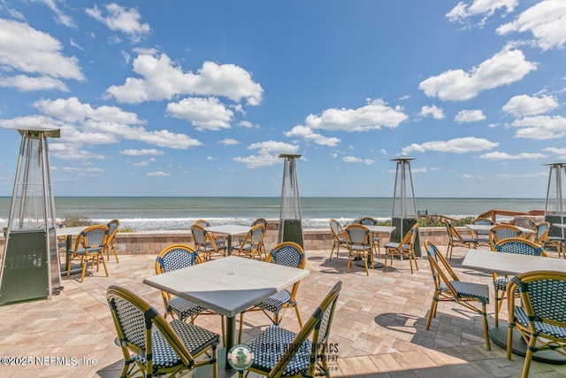 310 S Ocean Grande Dr Unit 205, Ponte Vedra Beach, FL 32082 - view of patio with outdoor dining area and a water view