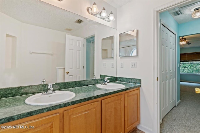2888 Majestic Oaks Ln, Green Cove Springs, FL 32043 - full bath featuring double vanity, a ceiling fan, and a textured ceiling