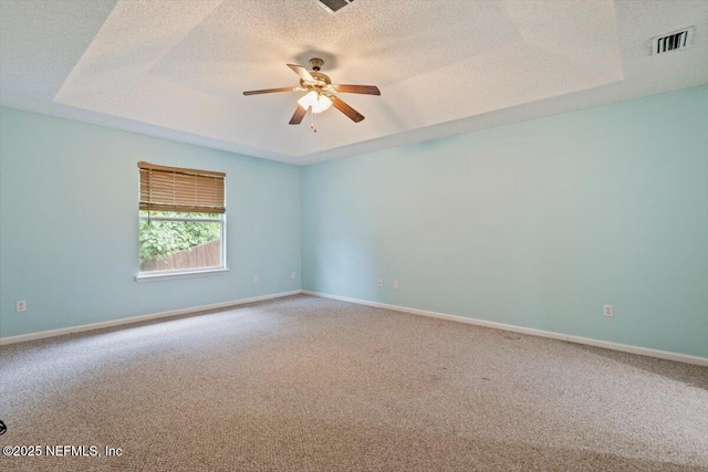 2888 Majestic Oaks Ln, Green Cove Springs, FL 32043 - unfurnished room with carpet, ceiling fan, a textured ceiling, and a raised ceiling