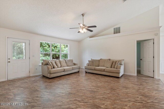 2888 Majestic Oaks Ln, Green Cove Springs, FL 32043 - living area featuring lofted ceiling, ceiling fan, and a textured ceiling