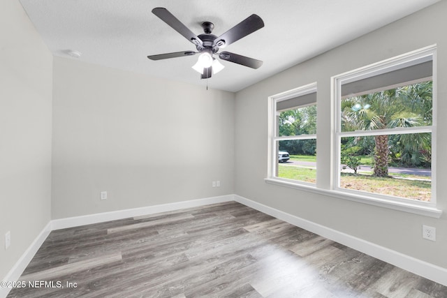 1731 W 28th St, Jacksonville, FL 32209 - empty room with wood finished floors, ceiling fan, and baseboards
