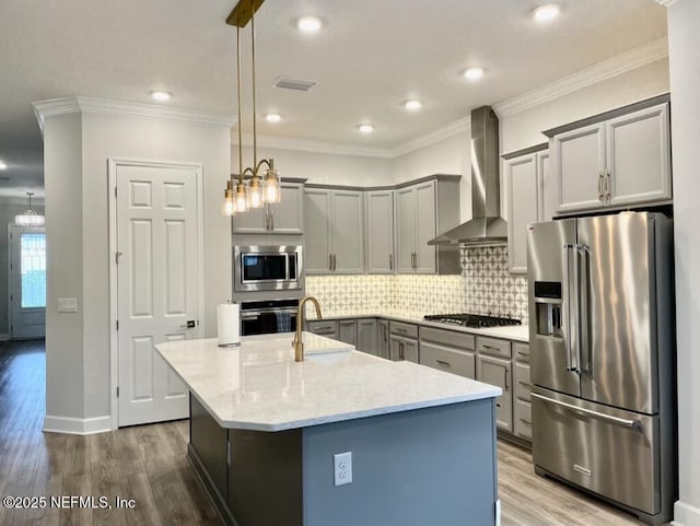 106 Shadow Ridge Trl, Ponte Vedra, FL 32081 - kitchen featuring appliances with stainless steel finishes, wall chimney range hood, gray cabinetry, wood finished floors, and decorative backsplash