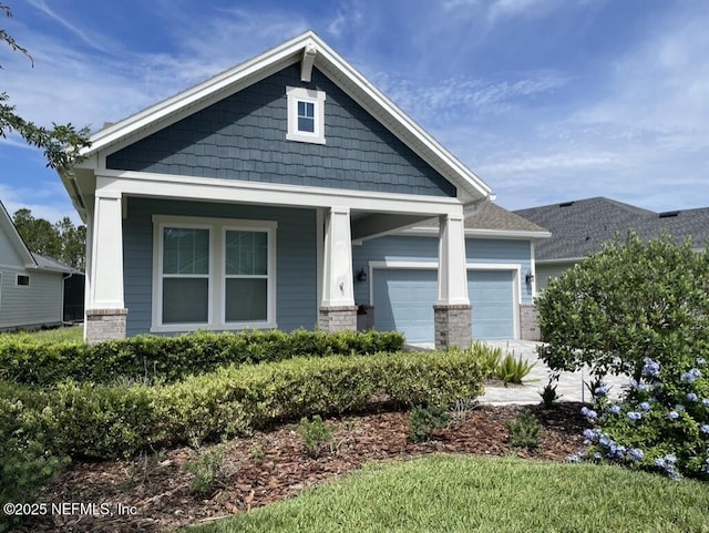 106 Shadow Ridge Trl, Ponte Vedra, FL 32081 - craftsman inspired home featuring an attached garage, covered porch, and brick siding