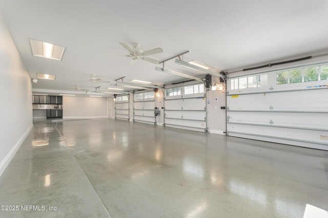 365 8th St, Atlantic Beach, FL 32233 - garage with baseboards and a ceiling fan