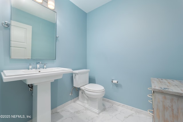 365 8th St, Atlantic Beach, FL 32233 - half bath with baseboards and marble finish flooring