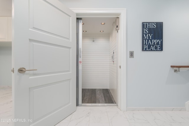 365 8th St, Atlantic Beach, FL 32233 - corridor with light marble finish flooring and recessed lighting