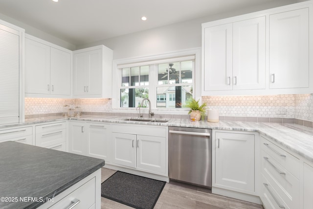 365 8th St, Atlantic Beach, FL 32233 - kitchen with dishwasher, white cabinets, recessed lighting, tasteful backsplash, and light wood finished floors