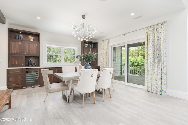 365 8th St, Atlantic Beach, FL 32233 - dining space with wine cooler, plenty of natural light, a chandelier, light wood-type flooring, and recessed lighting