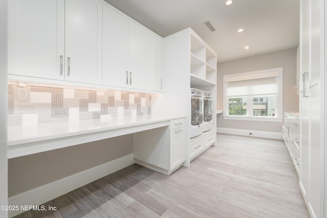 365 8th St, Atlantic Beach, FL 32233 - unfurnished office featuring light wood-style floors, recessed lighting, built in desk, and washer / dryer