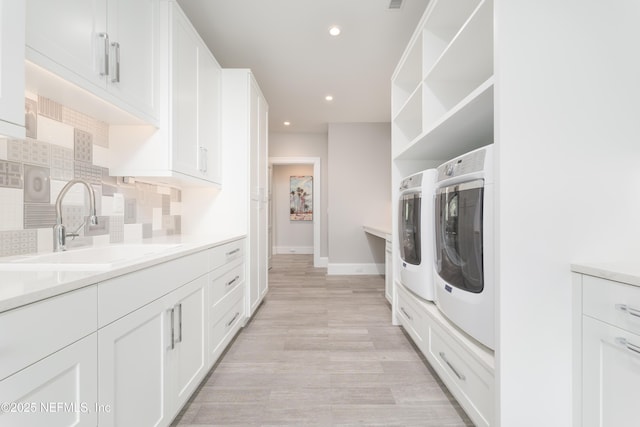 365 8th St, Atlantic Beach, FL 32233 - laundry area with separate washer and dryer, light wood-type flooring, recessed lighting, and cabinet space