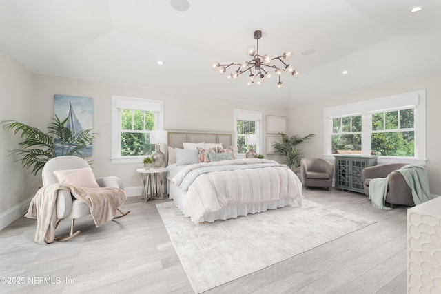 365 8th St, Atlantic Beach, FL 32233 - bedroom featuring a chandelier, recessed lighting, lofted ceiling, and light wood-type flooring