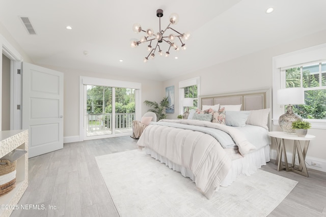 365 8th St, Atlantic Beach, FL 32233 - bedroom with access to exterior, a chandelier, light wood finished floors, and recessed lighting