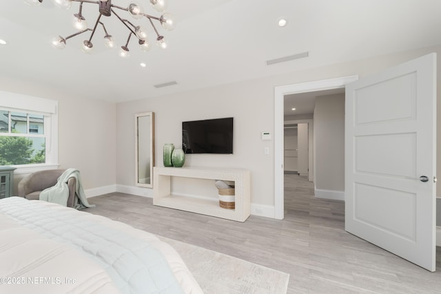 365 8th St, Atlantic Beach, FL 32233 - bedroom featuring light wood-style floors, a chandelier, and recessed lighting