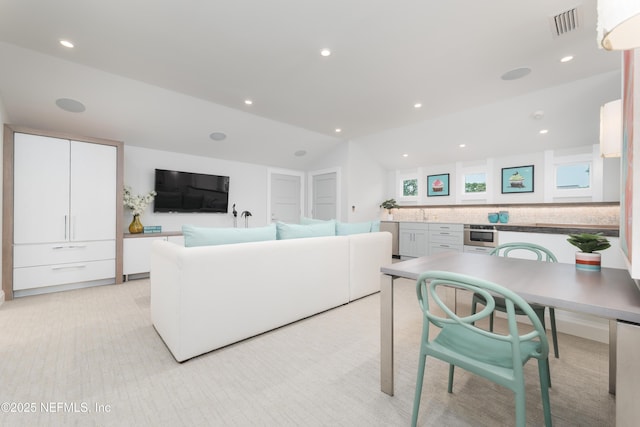 365 8th St, Atlantic Beach, FL 32233 - living area with vaulted ceiling, light carpet, and recessed lighting