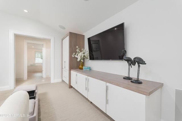 365 8th St, Atlantic Beach, FL 32233 - living room featuring vaulted ceiling and baseboards