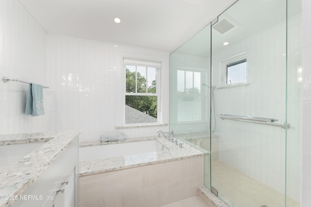 365 8th St, Atlantic Beach, FL 32233 - bathroom with a bath, a shower stall, vanity, and recessed lighting