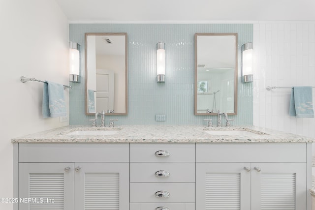 365 8th St, Atlantic Beach, FL 32233 - full bath with double vanity, tile walls, and decorative backsplash