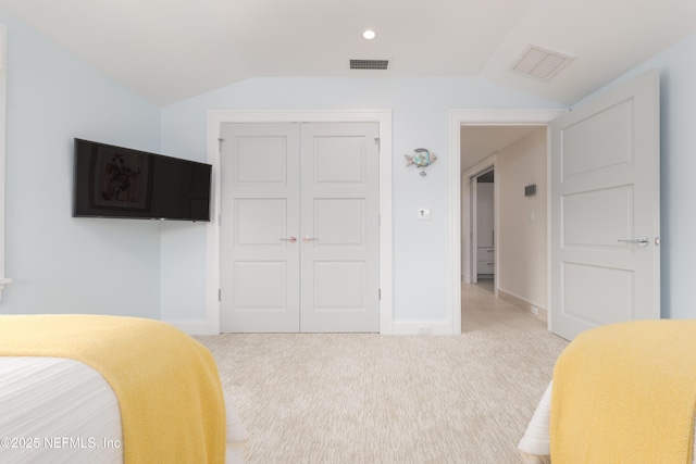 365 8th St, Atlantic Beach, FL 32233 - bedroom with lofted ceiling, a closet, and carpet flooring