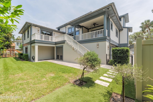365 8th St, Atlantic Beach, FL 32233 - rear view of house featuring stairway, stucco siding, a patio area, and a ceiling fan