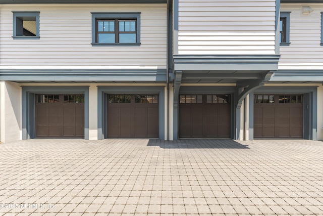 365 8th St, Atlantic Beach, FL 32233 - garage featuring decorative driveway