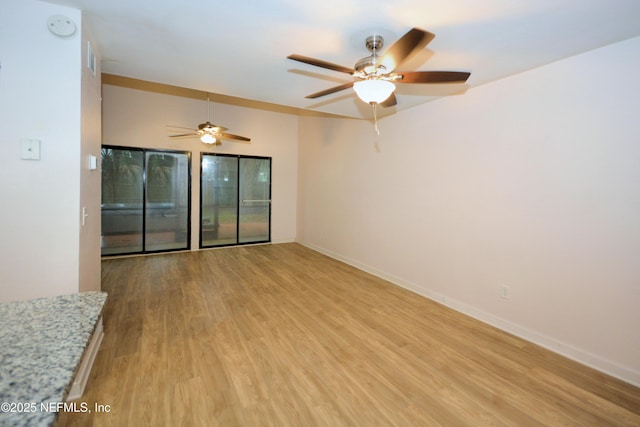 1266 Mayport Landing Cir, Jacksonville, FL 32233 - spare room featuring light wood finished floors, ceiling fan, a smoke detector, and baseboards