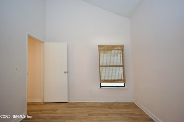 1266 Mayport Landing Cir, Jacksonville, FL 32233 - spare room with high vaulted ceiling, light wood-style floors, and baseboards