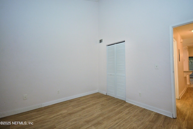 1266 Mayport Landing Cir, Jacksonville, FL 32233 - unfurnished bedroom with light wood-style flooring, baseboards, and a closet