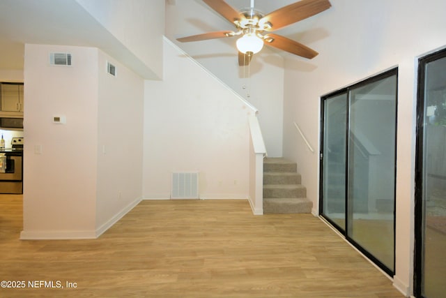 1266 Mayport Landing Cir, Jacksonville, FL 32233 - stairs with wood finished floors, ceiling fan, and baseboards