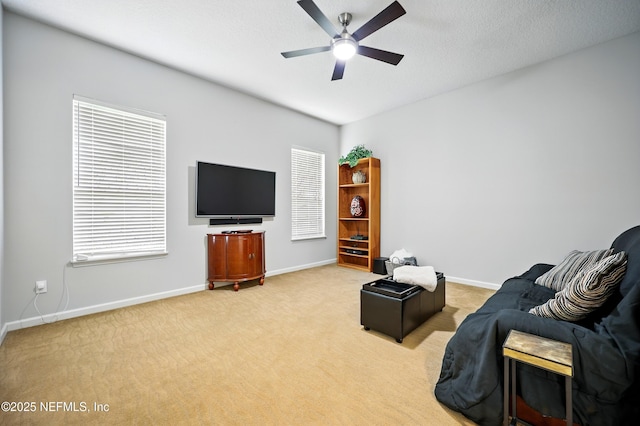 218 Sophia Ter, Saint Augustine, FL 32095 - living room featuring light carpet, ceiling fan, and baseboards