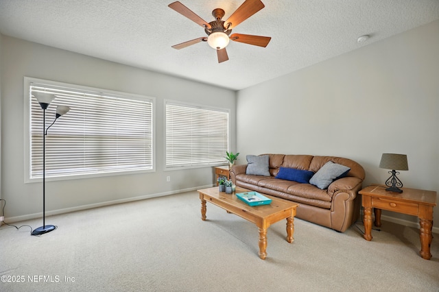 218 Sophia Ter, Saint Augustine, FL 32095 - carpeted living room with ceiling fan, healthy amount of natural light, baseboards, and a textured ceiling
