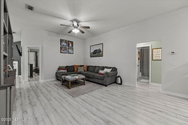 11214 Bentley Trace Ln E, Jacksonville, FL 32257 - living area featuring a ceiling fan, light wood-style flooring, and baseboards