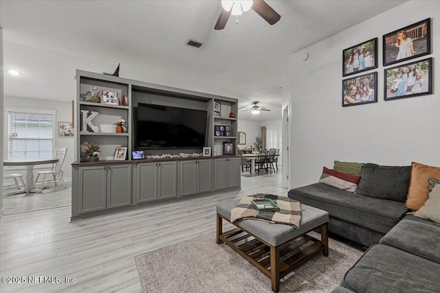 11214 Bentley Trace Ln E, Jacksonville, FL 32257 - living room featuring a ceiling fan and light wood finished floors
