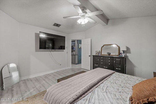 11214 Bentley Trace Ln E, Jacksonville, FL 32257 - bedroom featuring wood finished floors, a ceiling fan, a textured ceiling, and baseboards