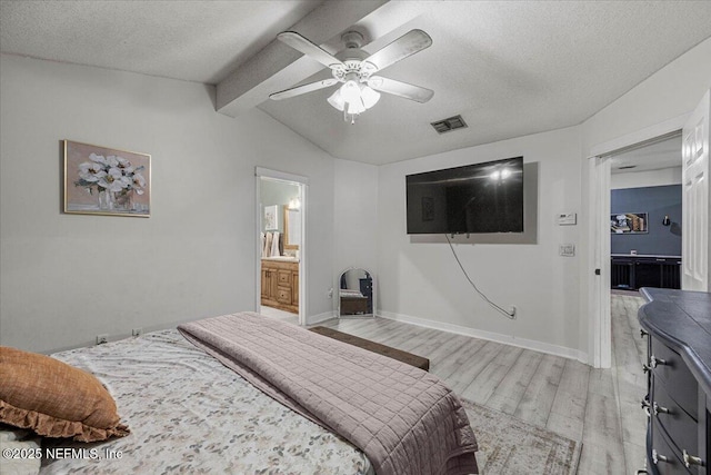 11214 Bentley Trace Ln E, Jacksonville, FL 32257 - bedroom with light wood-style floors, a textured ceiling, baseboards, ceiling fan, and ensuite bath