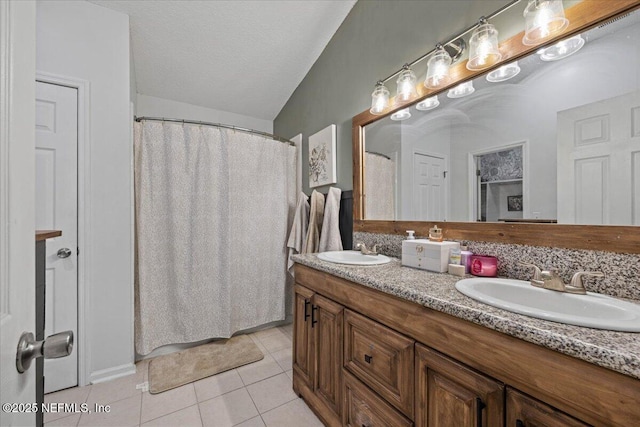 11214 Bentley Trace Ln E, Jacksonville, FL 32257 - bathroom featuring tile patterned flooring, double vanity, a shower with shower curtain, and a textured ceiling