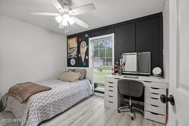 11214 Bentley Trace Ln E, Jacksonville, FL 32257 - bedroom with an office area, light wood-style floors, and ceiling fan